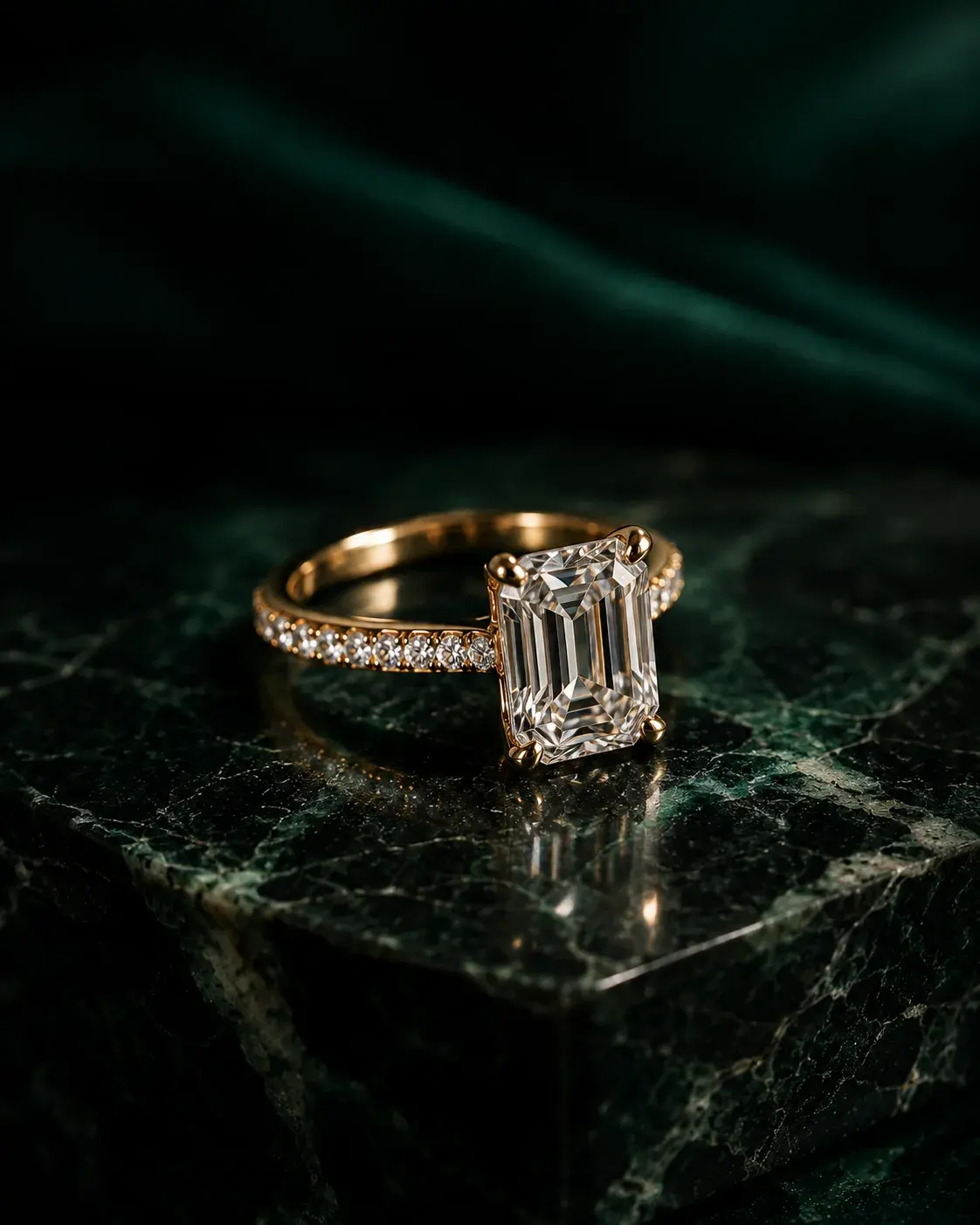 Diamond engagement ring on dark stone